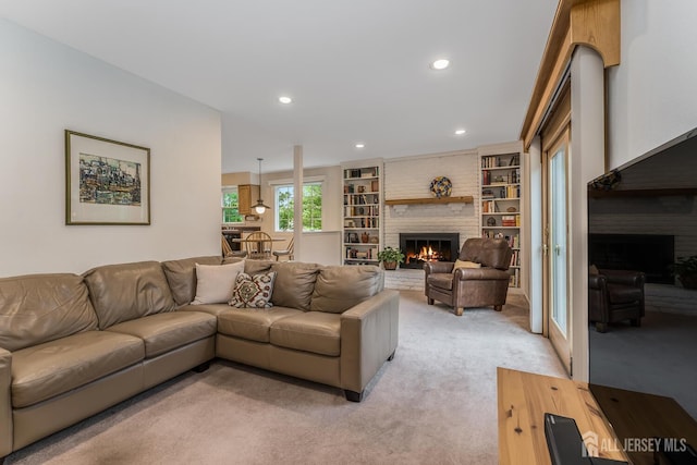 26 Magnolia Rd, Franklin Twsp, NJ 08873 - living room with a fireplace, light carpet, recessed lighting, and built in shelves
