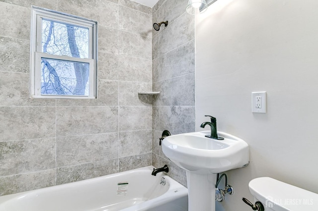 full bathroom featuring bathing tub / shower combination and toilet