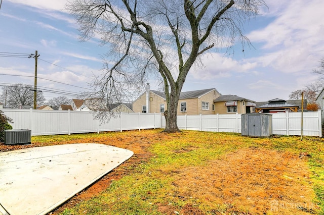 view of yard featuring a gazebo, cooling unit, and a fenced backyard