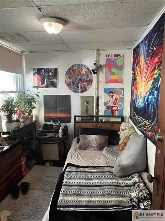 bedroom with a drop ceiling