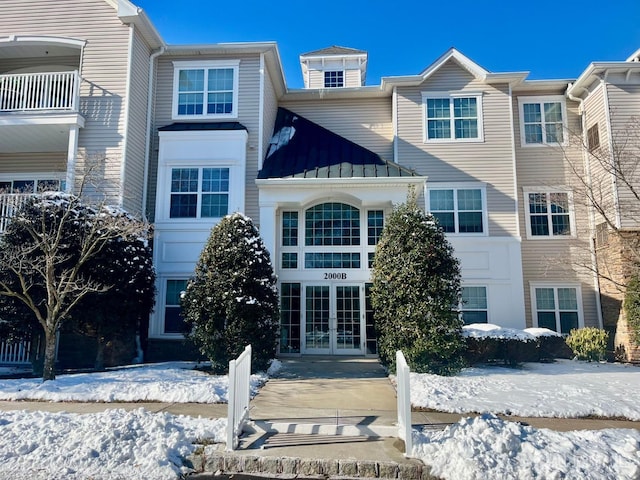 view of front of house featuring a standing seam roof, french doors, and metal roof