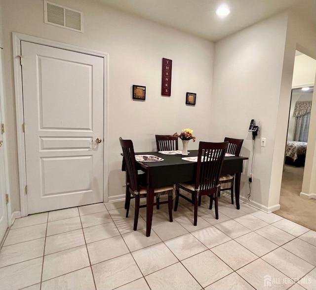 dining area featuring light tile patterned flooring, baseboards, visible vents, and recessed lighting
