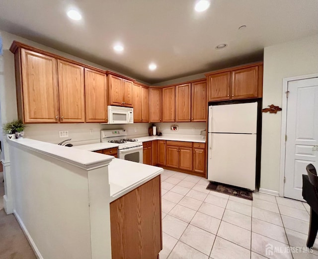 kitchen featuring light countertops, light tile patterned floors, a peninsula, recessed lighting, and white appliances