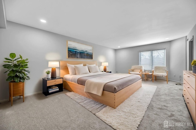 bedroom with recessed lighting, baseboards, and carpet floors