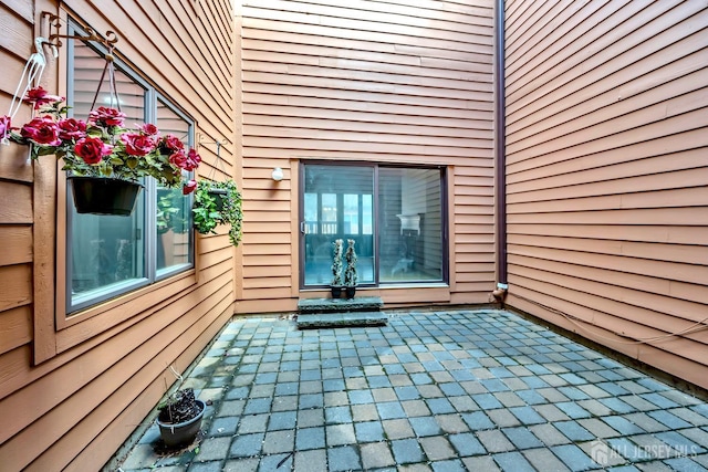 entrance to property with a patio