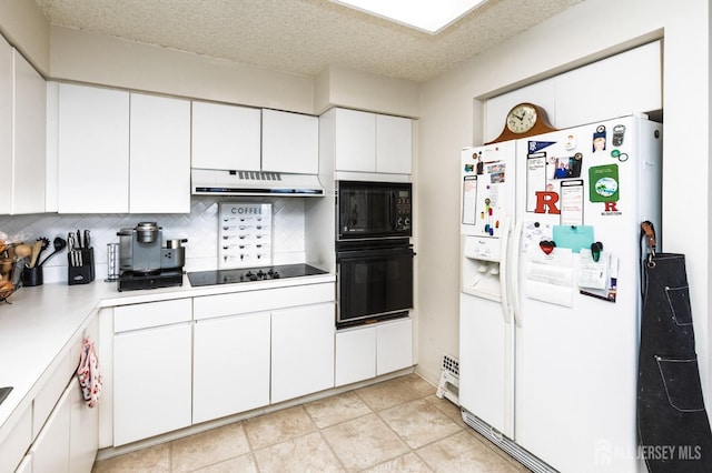 kitchen featuring under cabinet range hood, white cabinets, light countertops, backsplash, and black appliances