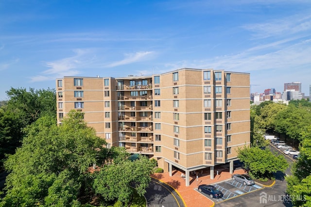 view of property featuring uncovered parking