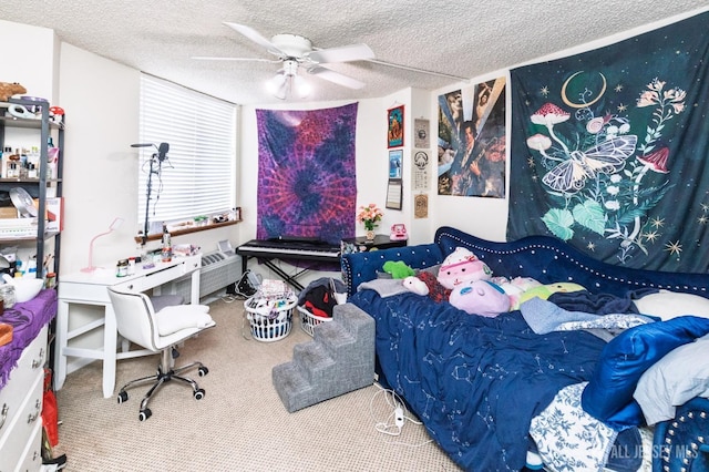 carpeted bedroom with a textured ceiling and ceiling fan