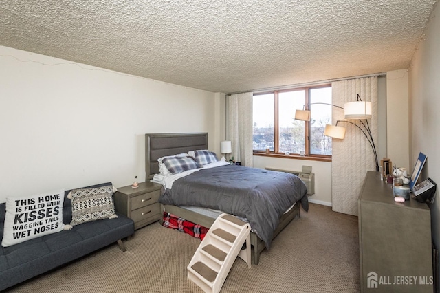 bedroom with light carpet and a textured ceiling