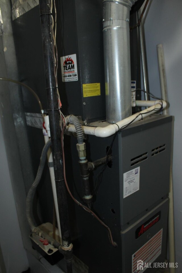 29 E Wycoff Way E, Brunswick, NJ 08816 - utility room with heating unit