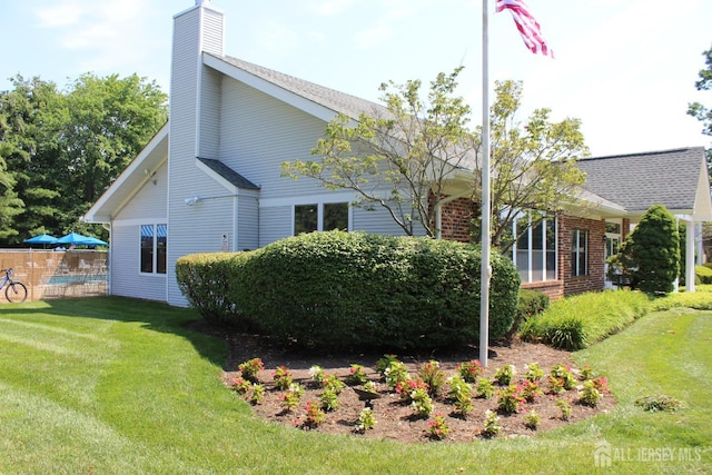 29 E Wycoff Way E, Brunswick, NJ 08816 - view of side of home featuring a chimney