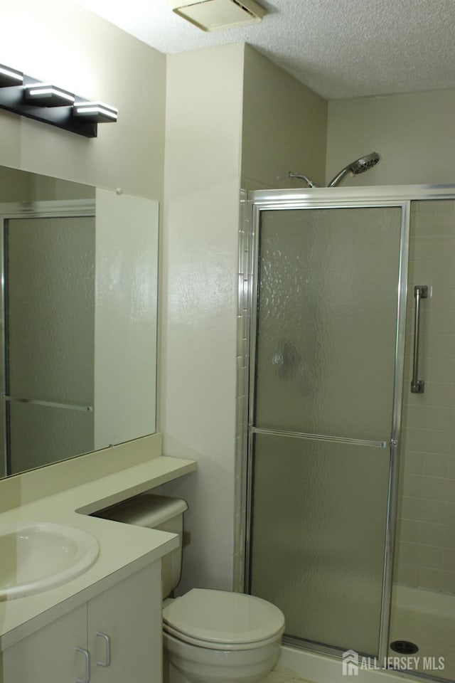 29 E Wycoff Way E, Brunswick, NJ 08816 - bathroom featuring vanity, a stall shower, and a textured ceiling