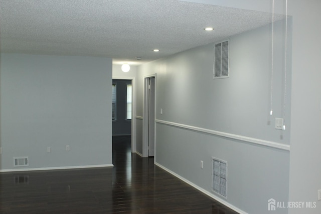 29 E Wycoff Way E, Brunswick, NJ 08816 - empty room with wood finished floors, a textured ceiling, and recessed lighting