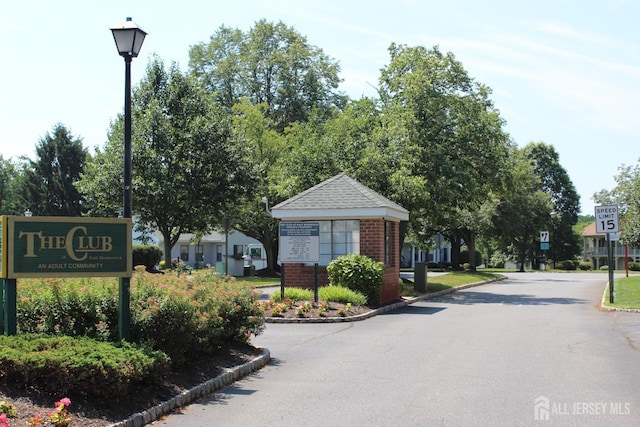 29 E Wycoff Way E, Brunswick, NJ 08816 - view of asphalt street featuring traffic signs, street lights, and curbs