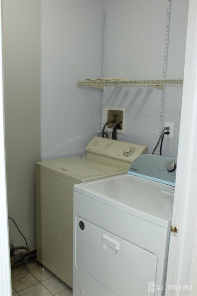 29 E Wycoff Way E, Brunswick, NJ 08816 - washroom featuring washer and clothes dryer and light tile patterned flooring