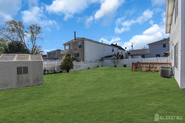 view of yard with a storage unit and central air condition unit