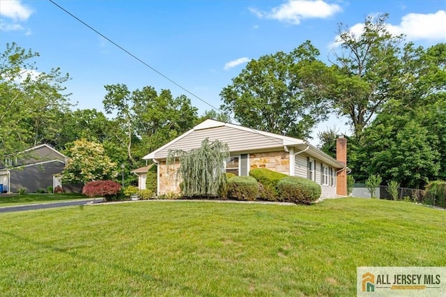 23 Spring St, Franklin, NJ 08873 - view of front of house featuring stone siding and a chimney