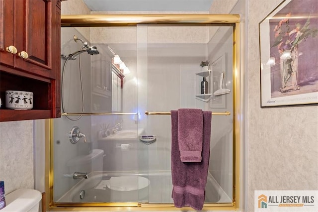 23 Spring St, Franklin, NJ 08873 - bathroom featuring toilet and combined bath / shower with glass door