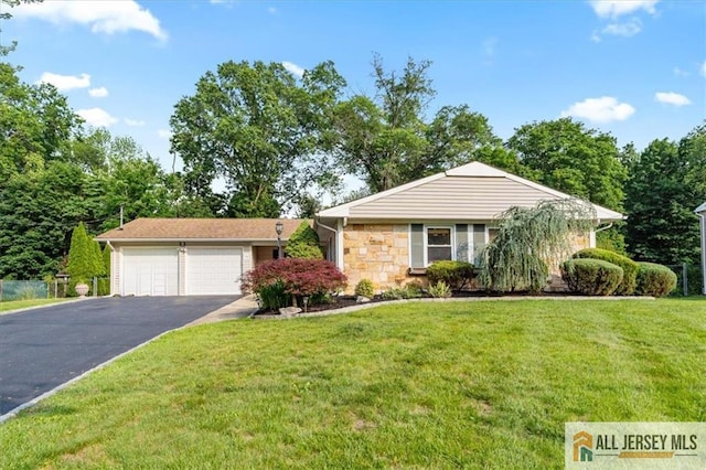 23 Spring St, Franklin, NJ 08873 - view of front of house featuring asphalt driveway, a front lawn, a garage, and stone siding