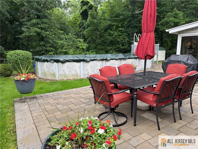 23 Spring St, Franklin, NJ 08873 - view of patio featuring a covered pool and outdoor dining area