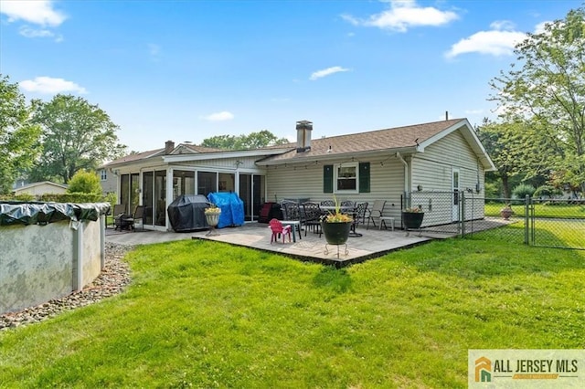 23 Spring St, Franklin, NJ 08873 - rear view of house with a sunroom and a patio area