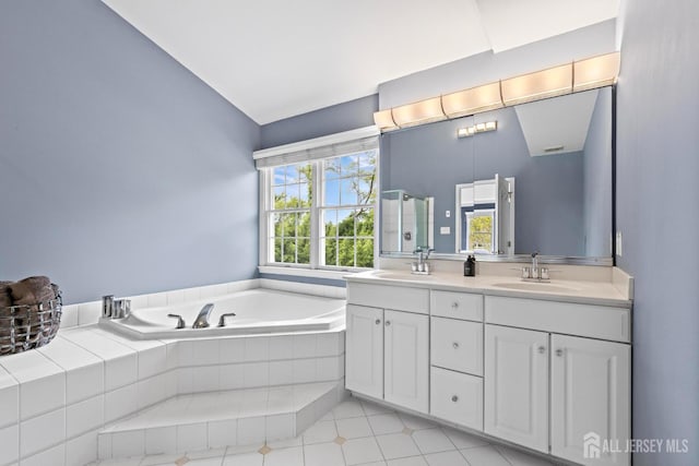 24 Saddle Ct, Monroe, NJ 08831 - bathroom featuring double vanity, a bath, vaulted ceiling, and tile patterned floors