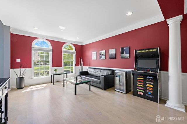24 Saddle Ct, Monroe, NJ 08831 - living area with decorative columns, beverage cooler, crown molding, wood finished floors, and recessed lighting