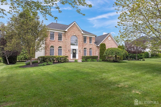 24 Saddle Ct, Monroe, NJ 08831 - colonial inspired home featuring brick siding and a front lawn