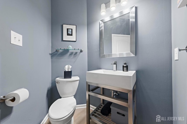24 Saddle Ct, Monroe, NJ 08831 - bathroom featuring toilet, wood finished floors, and baseboards
