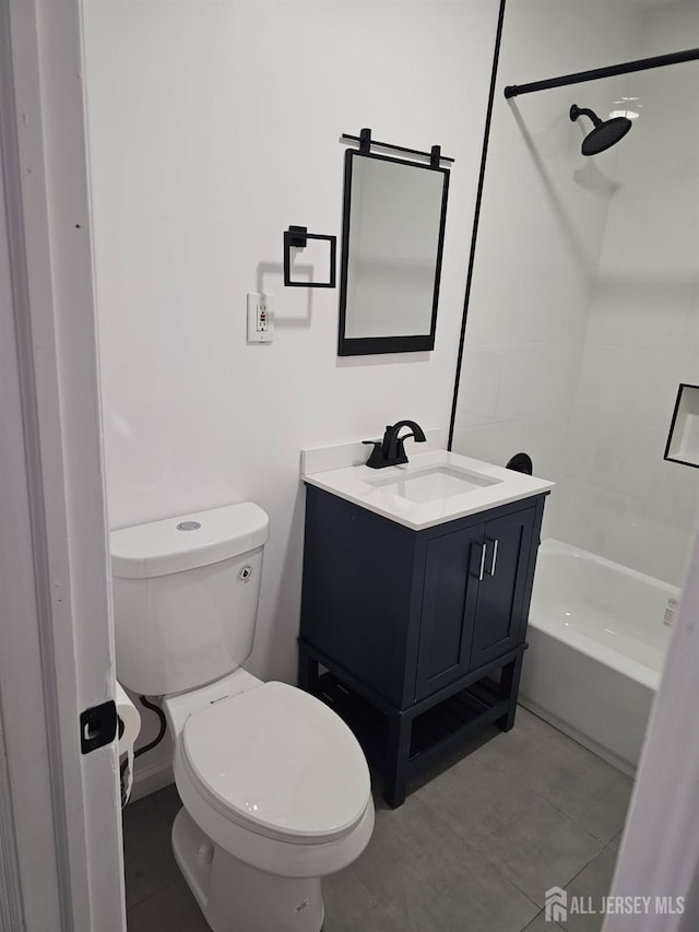 full bathroom featuring tiled shower / bath combo, vanity, and toilet