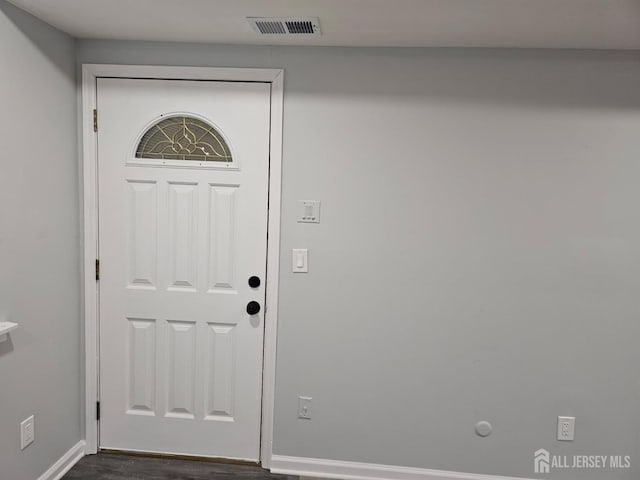 foyer entrance featuring dark hardwood / wood-style floors