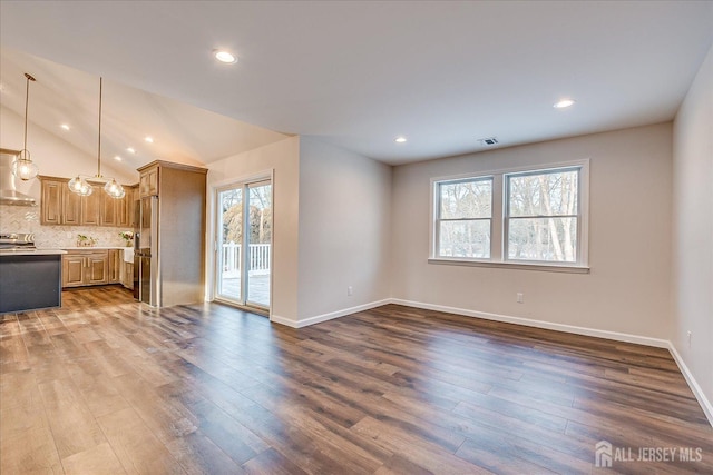 unfurnished living room featuring lofted ceiling and dark wood-type flooring