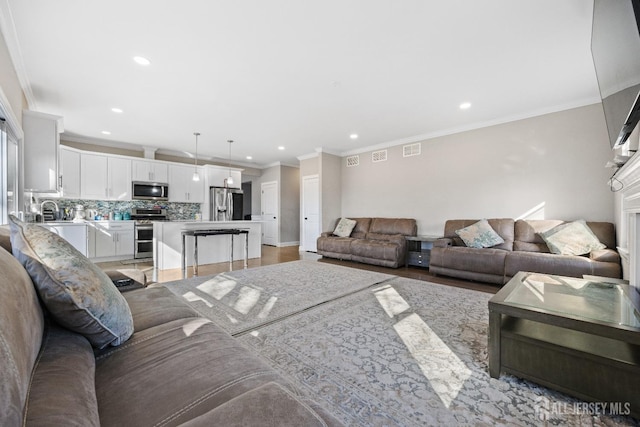 783 Aborn Ave, Woodbridge Proper, NJ 07095 - living room with recessed lighting, light wood-type flooring, crown molding, and baseboards