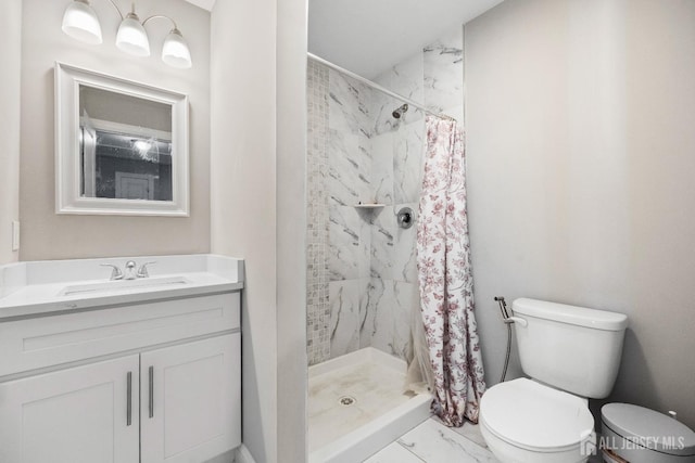 bathroom with toilet, marble look tiles, a shower stall, and vanity