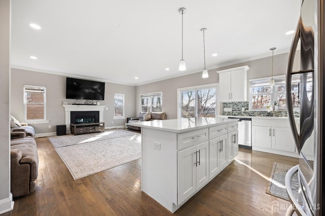 783 Aborn Ave, Woodbridge Proper, NJ 07095 - kitchen with stainless steel appliances, decorative backsplash, pendant lighting, light countertops, and crown molding