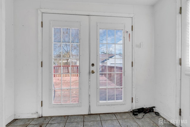 doorway featuring french doors and light tile patterned floors