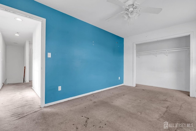 unfurnished bedroom featuring carpet flooring, ceiling fan, and a closet