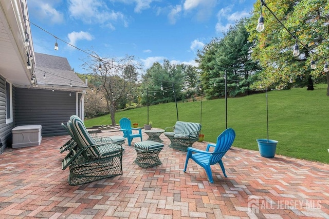 view of patio / terrace featuring a fire pit