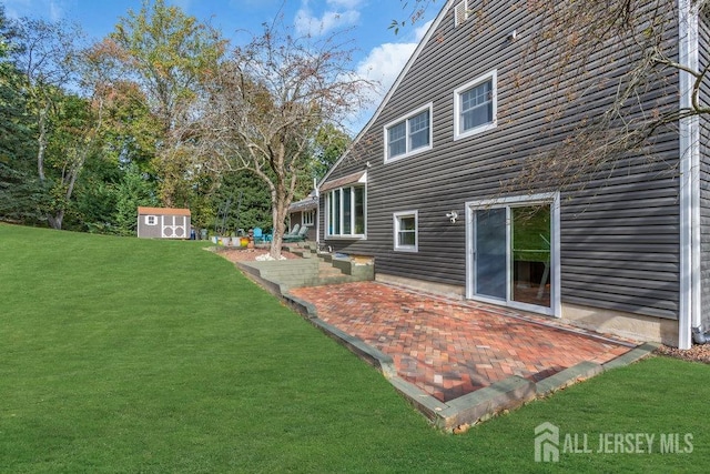 view of yard featuring a patio and a storage shed