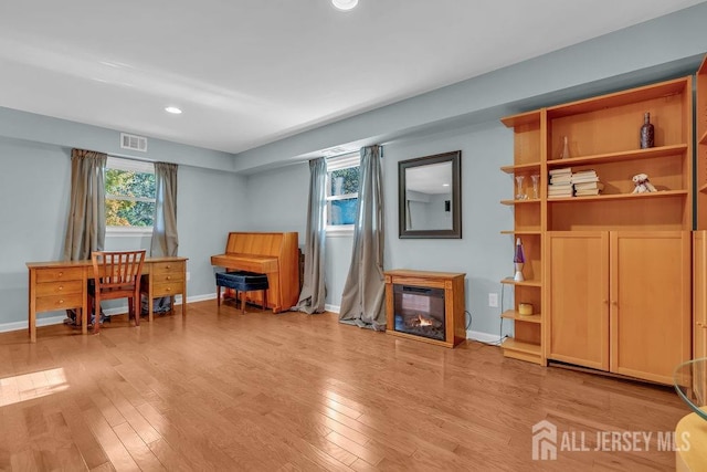 sitting room featuring light hardwood / wood-style flooring