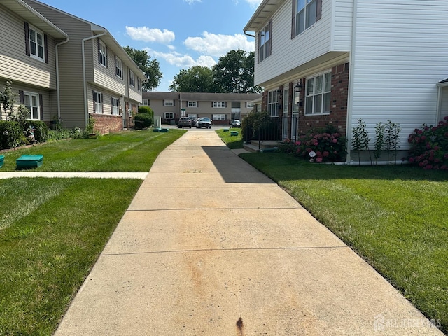 9 Maine Ct, Old Bridge, NJ 07747 - surrounding community featuring a lawn and a residential view