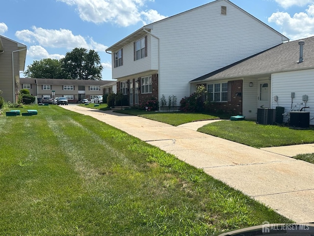 9 Maine Ct, Old Bridge, NJ 07747 - view of front of property with brick siding and a front yard