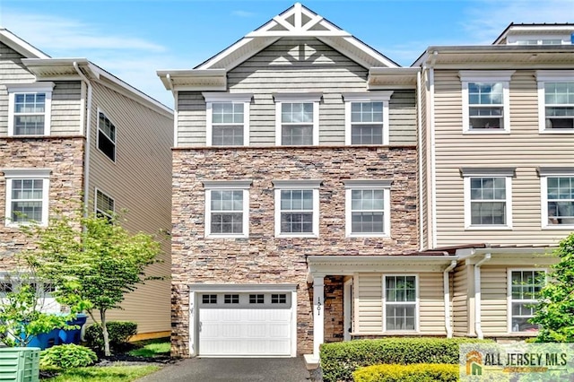 1501 Hights Farm Rd Unit 1501, Monroe, NJ 08831 - view of property featuring an attached garage, stone siding, and asphalt driveway