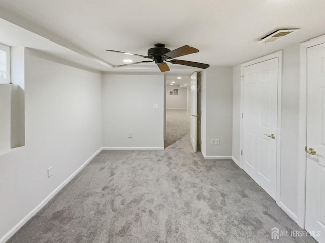 unfurnished bedroom with visible vents, baseboards, ceiling fan, and carpet flooring