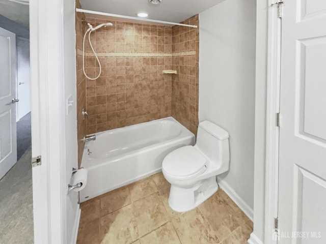 full bathroom with baseboards, toilet, and  shower combination