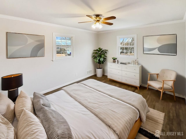 bedroom featuring visible vents, dark wood-type flooring, ceiling fan, baseboards, and ornamental molding