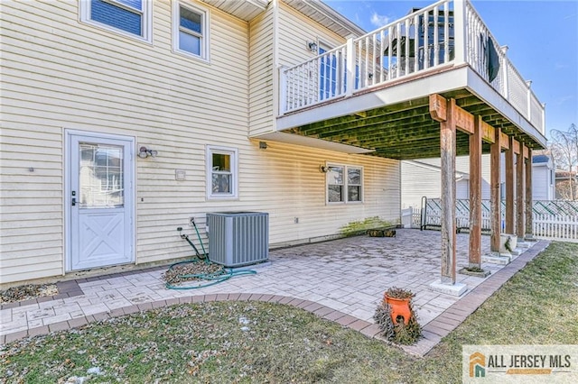 view of patio / terrace featuring fence and central AC unit