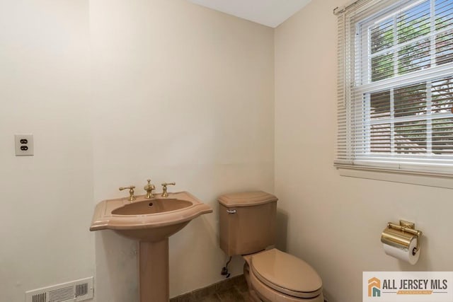 10 Lauri Ln, Middlesex, NJ 08846 - bathroom with toilet and wood finished floors