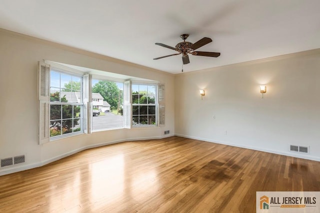10 Lauri Ln, Middlesex, NJ 08846 - spare room featuring crown molding, a ceiling fan, baseboards, and wood finished floors