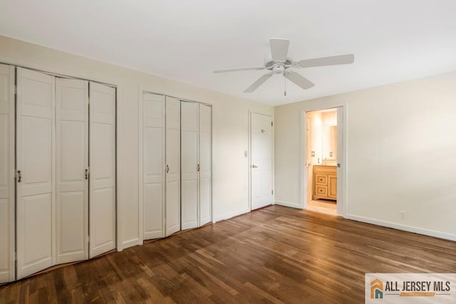 10 Lauri Ln, Middlesex, NJ 08846 - unfurnished bedroom with two closets, dark wood finished floors, baseboards, ceiling fan, and ensuite bathroom